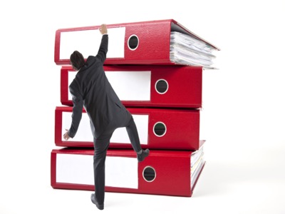 Professional navigating complex regulatory documentation and paperwork - representing Minnesota cannabis license application process assistance